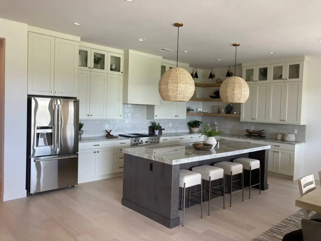 Beautiful Marble Island Kitchen Counter with Combination of Crème and Dark Gray Storages in a Cedar City Home