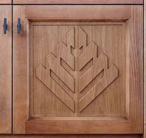 Cabinet door with the Peppermint Cabinets logo engraved